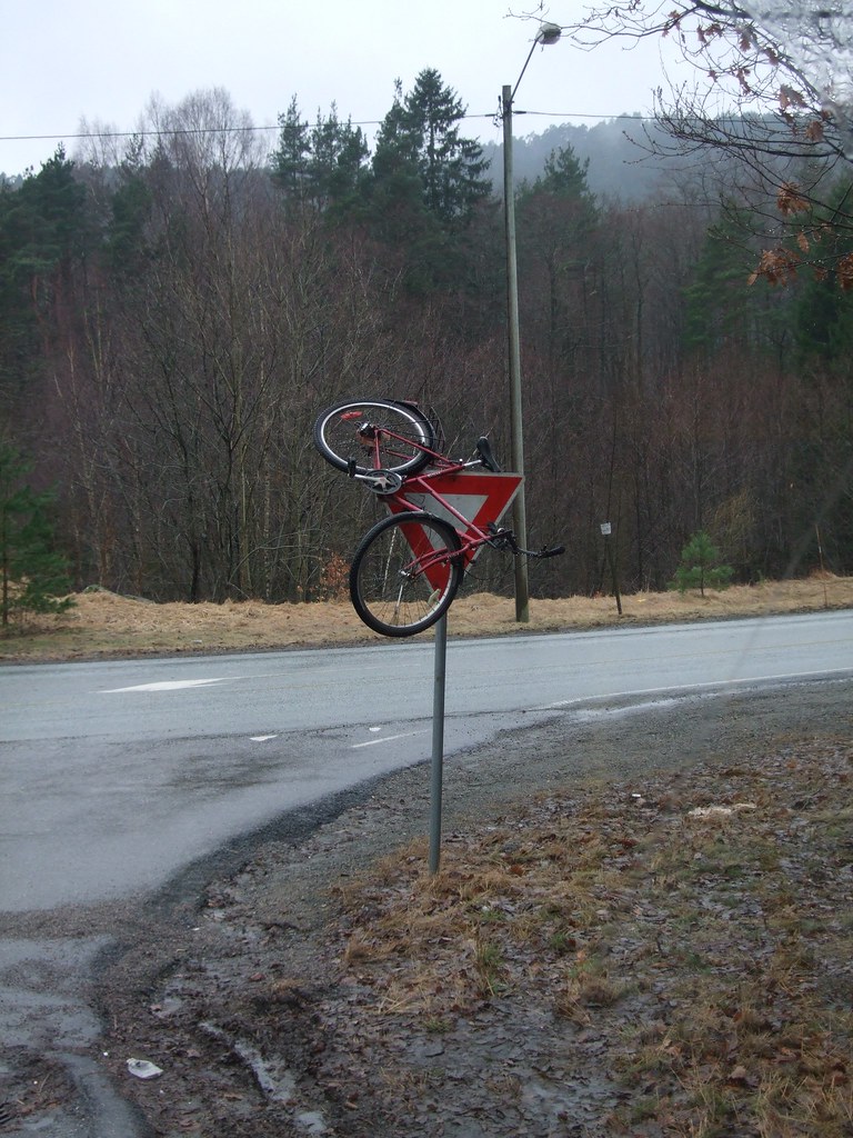 Bike hanging on sign